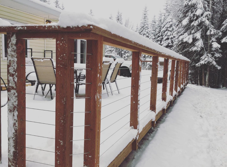 snowy area with wooden deck